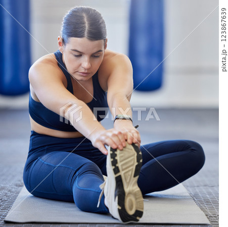Fitness, stretching and sports woman at gym for training, exercise and warm up workout for wellness and healthy lifestyle. Athlete woman, sports and stretch for body balance and health in pilates 123867639