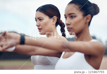 Stretching, arms and women training for fitness, cardio health and wellness together in nature. Athlete friends with focus during a workout, outdoor exercise or warm up in a park in the city 123867793