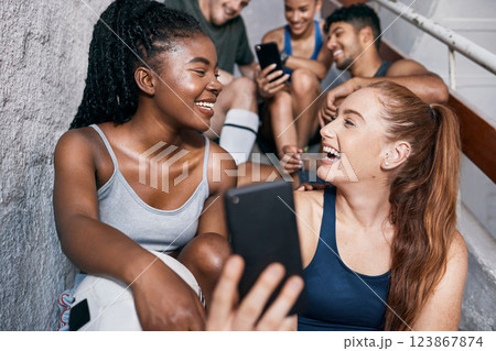 Fitness, social media and friends with phone and networking on stairs for internet, training and health. Communication, contact and technology with women and mobile for exercise, workout or wellness Fitness, social media and friends with phone and networking on stairs for internet, training and health. Communication, contact and technology with women and mobile for exercise, workout or wellness 123867874