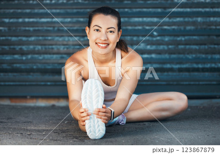 Fitness, woman and stretching with smile on street for warm up exercise, workout and health in the outdoors. Active female in leg stretch for healthy sports training or practice for cardio routine Fitness, woman and stretching with smile on street for warm up exercise, workout and health in the outdoors. Active female in leg stretch for healthy sports training or practice for cardio routine 123867879