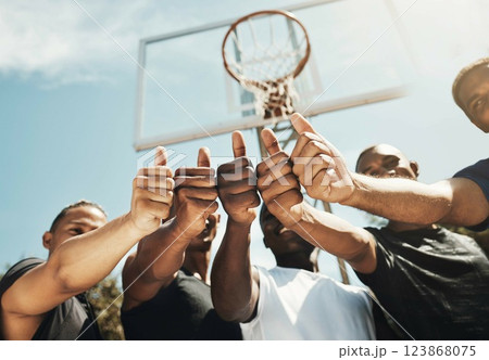 Basketball court, sports men and thumbs up success in fitness workout motivation, training trust and exercise community support. Low angle, friends and players with winner goals or vote hand gesture Basketball court, sports men and thumbs up success in fitness workout motivation, training trust and exercise community support. Low angle, friends and players with winner goals or vote hand gesture 123868075
