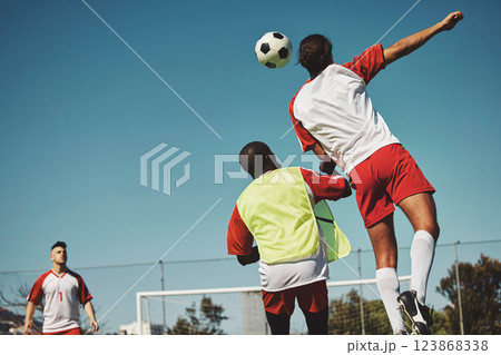 Sports game fitness, soccer jump and athlete play competition for exercise, workout or training for body health. Rival, team and street football for practice, wellness and cardio with mockup blue sky 123868338
