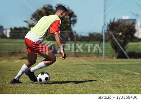 Man, running or soccer ball on grass field for sports, training or workout in competition match. Football player, athlete or fitness person in workout, training or exercise for wellness or speed game Man, running or soccer ball on grass field for sports, training or workout in competition match. Football player, athlete or fitness person in workout, training or exercise for wellness or speed game 123868430