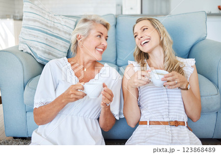 Coffee, comic communication and mother with daughter on the living room floor of their house. Elderly woman speaking, giving advice and in conversation with her adult child with tea in the lounge Coffee, comic communication and mother with daughter on the living room floor of their house. Elderly woman speaking, giving advice and in conversation with her adult child with tea in the lounge 123868489