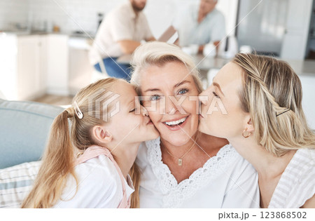 Grandma, family and child giving a kiss on cheek and senior woman with smile sitting with mother and child on sofa at home. Portrait of happy grandparent bonding with girl and daughter on mothers day Grandma, family and child giving a kiss on cheek and senior woman with smile sitting with mother and child on sofa at home. Portrait of happy grandparent bonding with girl and daughter on mothers day 123868502