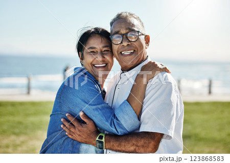Love, hug and happy senior couple enjoy romantic quality time together, travel vacation or bond on outdoor grass field. Happiness, partnership and elderly man, woman or people smile on Mexico holiday 123868583