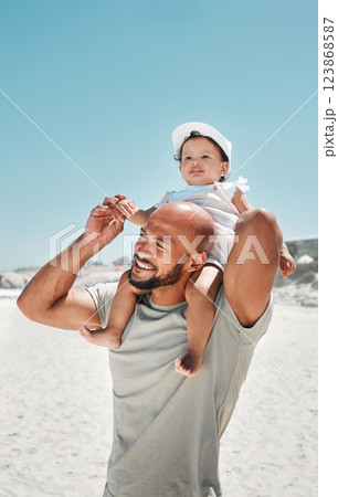 Travel, family and baby and father at a beach in Florida, relax, bonding and having fun in summer on vacation. Love, girl and cheerful parent walking and enjoying fresh air at the ocean in Mexico 123868587