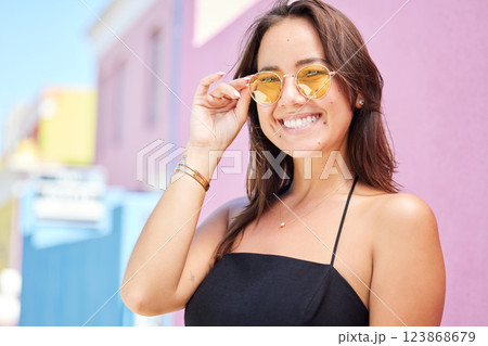 Fashion, beauty and glasses with a woman in the city during a sunny summer day with a smile. 123868679