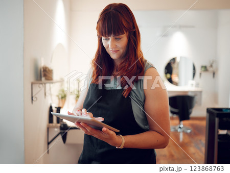 Woman, digital tablet and salon schedule for small business calendar, internet booking or customer management. Smile happy and thinking hair stylist on technology for hairdresser dye stock management 123868763