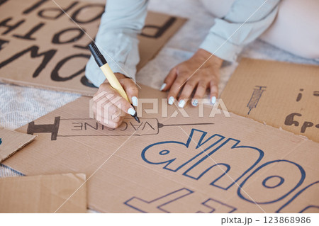 Covid, poster and protest sign woman prepare, create and use carboard for vaccine, corona safety and protection. Female, write and demonstrators against vaccinations, make placard and slogan. Covid, poster and protest sign woman prepare, create and use carboard for vaccine, corona safety and protection. Female, write and demonstrators against vaccinations, make placard and slogan. 123868986