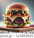 A mouthwatering gourmet burger. The burger features a toasted sesame seed bun, a thick and juicy beef patty, melted cheese, bacon, onion, salat 123869025