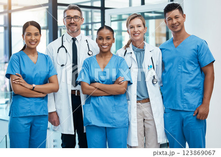 Happy doctors and nurse smile at a hospital with support, teamwork and collaboration with diversity. Team of expert medical professionals smiling at work together at clinic in the healthcare industry 123869067