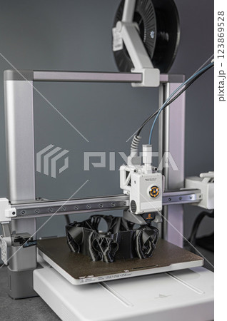Modern 3D printer printing figure close-up 123869528