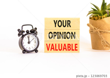 Your opinion valuable symbol. Concept words Your opinion valuable on beautiful wooden blocks. Beautiful white background. Black alarm clock. Business your opinion valuable concept. Copy space. Your opinion valuable symbol. Concept words Your opinion valuable on beautiful wooden blocks. Beautiful white background. Black alarm clock. Business your opinion valuable concept. Copy space. 123869703
