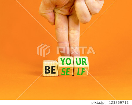 Motivational be yourself symbol. Concept words Be yourself on beautiful wooden block. Beautiful orange background Businessman hand. Business motivational be yourself concept. Copy space. 123869711