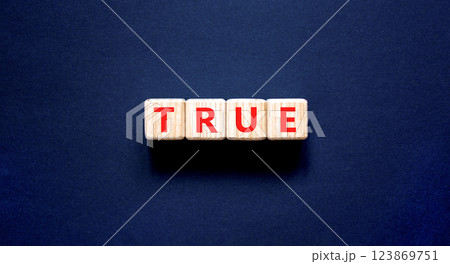 True symbol. Concept word True on beautiful wooden blocks. Beautiful black table black background. Business, lifestyle, support and true concept. Copy space. True symbol. Concept word True on beautiful wooden blocks. Beautiful black table black background. Business, lifestyle, support and true concept. Copy space. 123869751