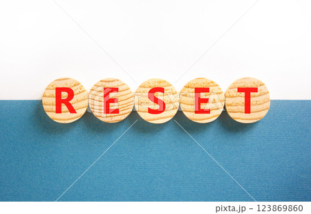 Reset symbol. Concept word Reset on beautiful wooden circles. Beautiful white and blue background. Business lifestyle reset concept. Copy space. Reset symbol. Concept word Reset on beautiful wooden circles. Beautiful white and blue background. Business lifestyle reset concept. Copy space. 123869860