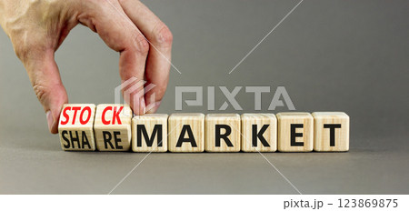 Stock or share market symbol. Concept words Stock market or Share market on beautiful wooden blocks. Beautiful grey background. Businessman hand. Business stock or share market concept. Copy space. Stock or share market symbol. Concept words Stock market or Share market on beautiful wooden blocks. Beautiful grey background. Businessman hand. Business stock or share market concept. Copy space. 123869875