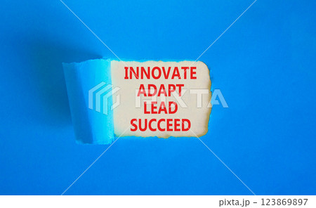 Innovate adapt lead succeed symbol. Concept words Innovate Adapt Lead Succeed on beautiful white paper. Beautiful blue table blue background. Business innovate adapt lead succeed concept. Copy space. Innovate adapt lead succeed symbol. Concept words Innovate Adapt Lead Succeed on beautiful white paper. Beautiful blue table blue background. Business innovate adapt lead succeed concept. Copy space. 123869897