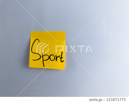 Motivational word written on sticky note to motivate start sport exercise Motivational word written on sticky note to motivate start sport exercise 123871773
