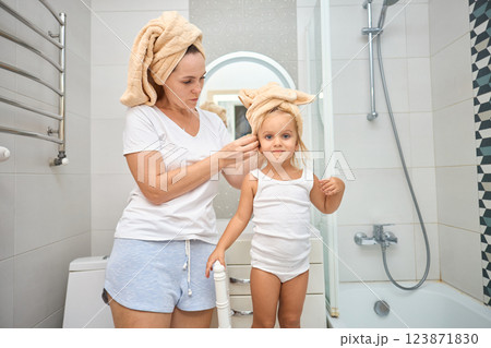 Mother of a child daughter with a towel dry hair Mother of a child daughter with a towel dry hair 123871830