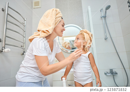 Mother of a child daughter with a towel dry hair Mother of a child daughter with a towel dry hair 123871832