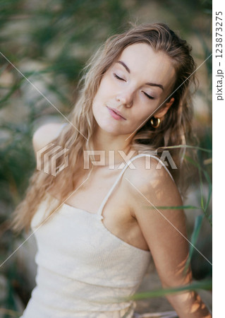 Blonde caucasian woman with pure clean skin, enjoy summer with closed eyes, natural beauty 123873275