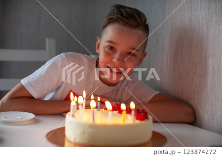 Happy Boy Celebrating Birthday with Cake 123874272
