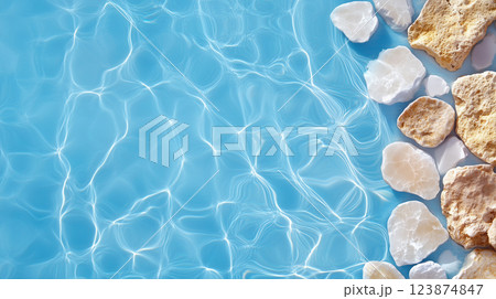 Beautiful Arrangement of Pebbles and Light on Water Surface 123874847
