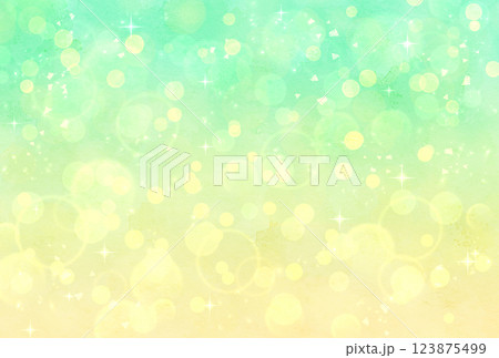 緑と黄色のグラデーションのキラキラ背景 123875499