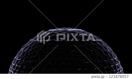 Gray hologram golf ball on black background. Brigh Gray hologram golf ball on black background. Brigh 123876057