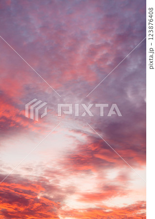 Colorful vibrant clouds on sky at sunset Colorful vibrant clouds on sky at sunset 123876408