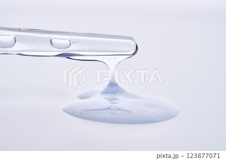 Pipette with delicate blue serum close-up. Pipette with delicate blue serum close-up. 123877071