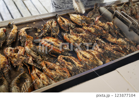 Delicious lobsters grilling on a hot barbecue grill 123877104