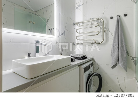 Modern Bathroom with White Marble Walls and Sink Modern Bathroom with White Marble Walls and Sink 123877803