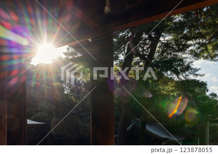 Bright sun rays filter through the shrine gate in Tokyo, producing vivid rainbow flares Bright sun rays filter through the shrine gate in Tokyo, producing vivid rainbow flares 123878055