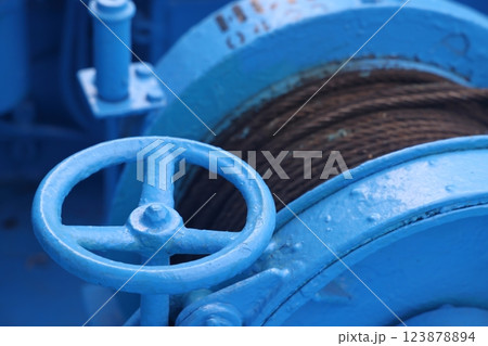 The mooring deck of a cargo ship with anchor winches, an anchor chain on winches, ship mechanisms. 123878894
