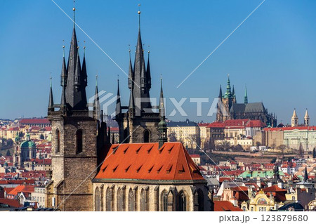 Gothic Church of Our Lady before Tyn with St. Vitus Cathedral and Prague Castle in background, Prague, Czech Republic, sunny day 123879680