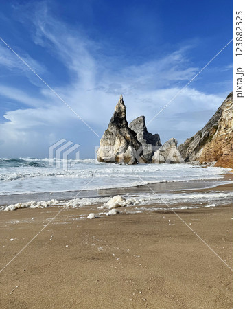 Majestic rocky beach in Atlantic Ocean coastline. Praia da Ursa beach, Sintra, Portugal. Majestic rocky beach in Atlantic Ocean coastline. Praia da Ursa beach, Sintra, Portugal. 123882325