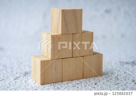 Stacking wooden cubes with customizable space for text. Copy space concept. 123882837