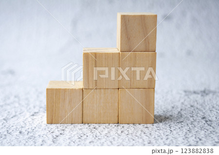 Stacking wooden cubes with customizable space for text. Copy space concept. Stacking wooden cubes with customizable space for text. Copy space concept. 123882838