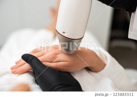 RF lifting in a beauty salon. 123883311