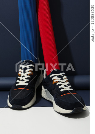Stylish sneakers with a white sole on a blue background 123888539