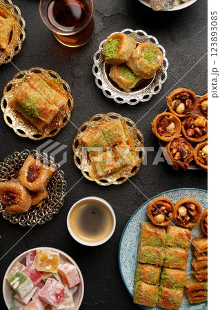 Exquisite selection of traditional Middle Eastern desserts served with tea in an elegant setting 123893085