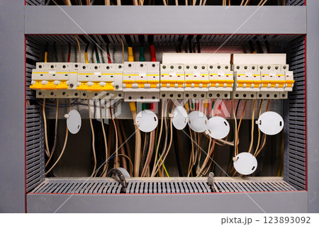 Network control panel with organized wiring and components in a utility room 123893092