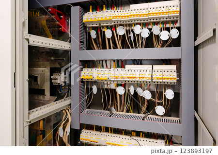 Electrical control panel with organized wiring and components in a commercial building 123893197