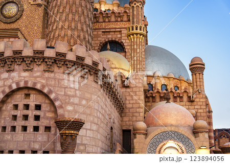 Exploring the intricate architecture of a historical building in Cairo during sunset Exploring the intricate architecture of a historical building in Cairo during sunset 123894056