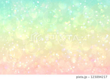 カラフルなグラデーションのキラキラ背景　緑　黄色　ピンク　イルミネーション　玉ボケ　光 123894217