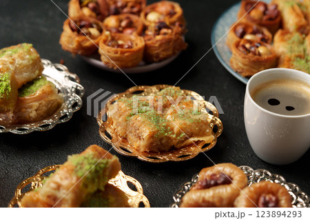 Delicious assortment of pastries and coffee served together at a cozy cafe setting Delicious assortment of pastries and coffee served together at a cozy cafe setting 123894293