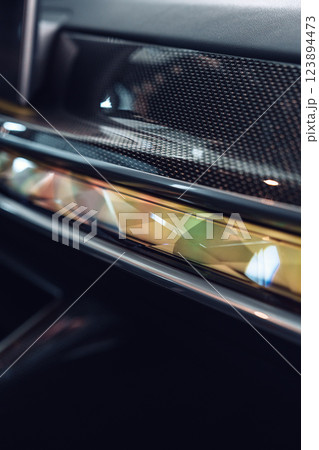 Close-up view of modern car interior features highlighting design elements and craftsmanship with intricate details Close-up view of modern car interior features highlighting design elements and craftsmanship with intricate details 123894473